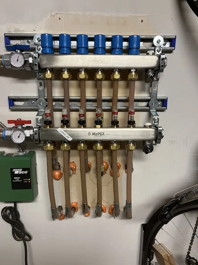 Plumber performing Water Heater Repair at a residential property in Cozad